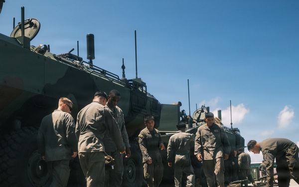 USS Rushmore ports and off-loads troops and equipment