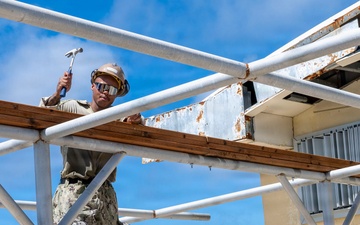NMCB 1 installs walkway roof at Saipan Southern High School