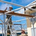 NMCB 1 installs walkway roof at Saipan Southern High School