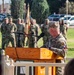 U.S. Army soldier addresses formation during military ceremony at Fort Bliss, Texas