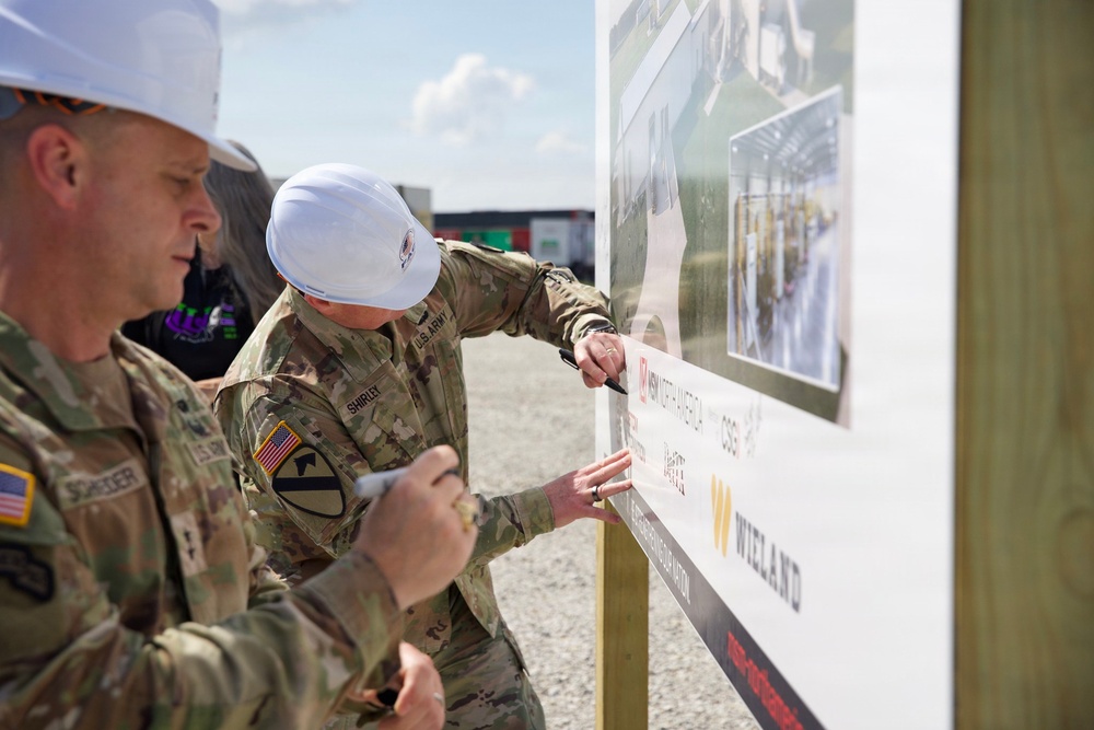Army Sustainment Command's Commander, MG Eric Shirley, and MG Christopher Schneider, Commander, PAE A&amp;A sign the future artillery complex sign for the groundbreaking ceremony at the U.S. Army Iowa Army Ammunition Plant.