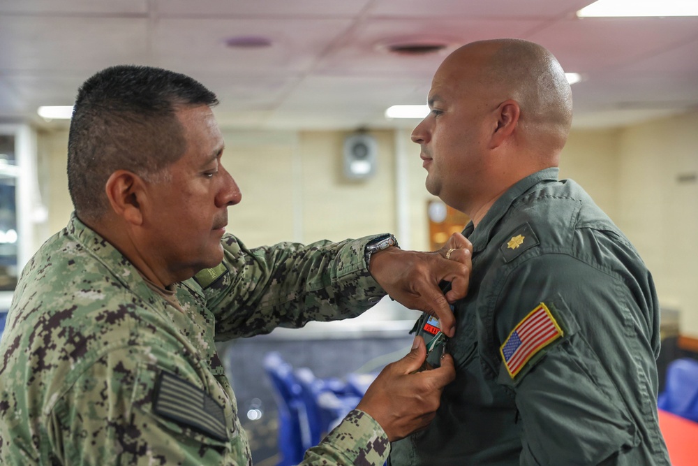 Lt. Cmdr. Guzman Receives Award and Rung Off