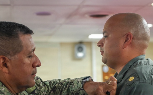 Lt. Cmdr. Guzman Receives Award and Rung Off