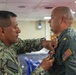 Lt. Cmdr. Guzman Receives Award and Rung Off