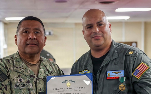 Lt. Cmdr. Guzman Receives Award and Rung Off