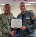 Lt. Cmdr. Guzman Receives Award and Rung Off