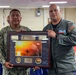 Lt. Cmdr. Guzman Receives Award and Rung Off