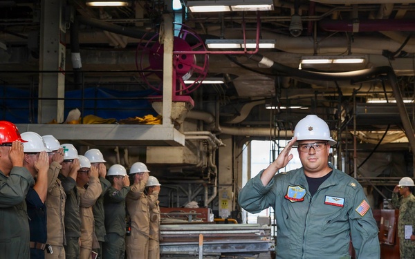 Lt. Cmdr. Guzman Receives Award and Rung Off
