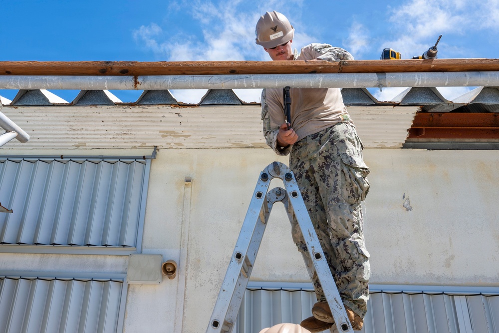 NMCB 1 installs walkway roof at Saipan Southern High School