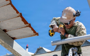 NMCB 1 installs walkway roof at Saipan Southern High School