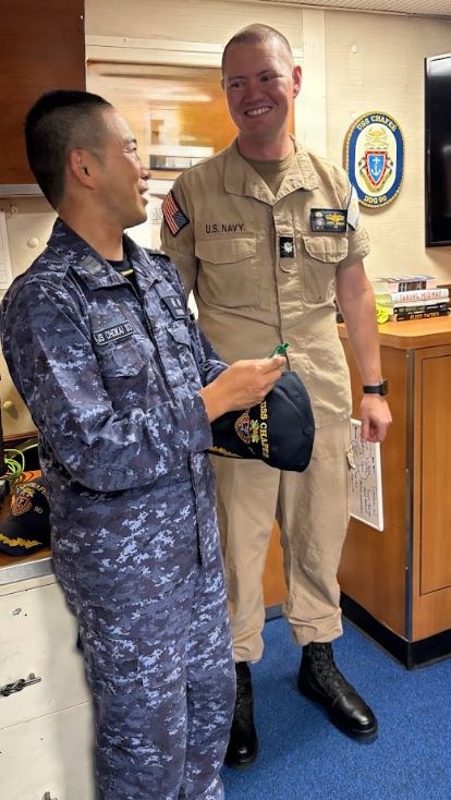 USS Chafee Executive Officer Presents JS Chōkai Executive Officer With Pen