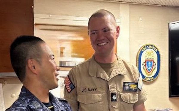 USS Chafee Executive Officer Presents JS Chōkai Executive Officer With Pen
