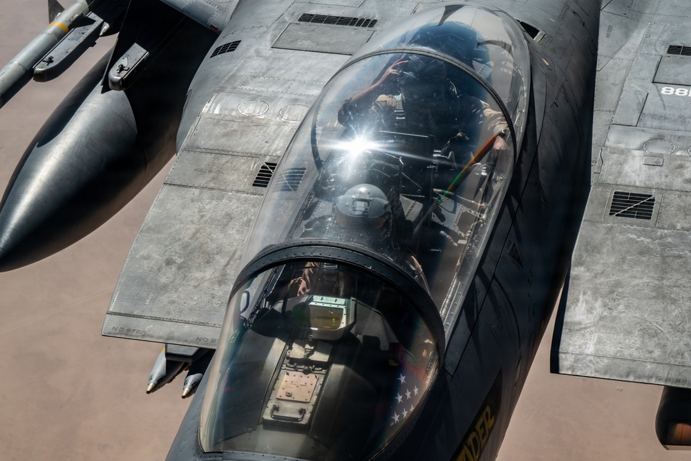 KC-135 refuels F-15 for strategic support