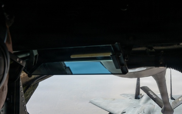 KC-135 refuels F-15 for strategic support
