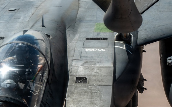 KC-135 refuels F-15 for strategic support