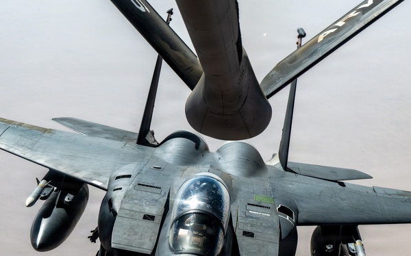 KC-135 refuels F-15 for strategic support