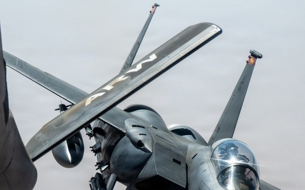 KC-135 refuels F-15 for strategic support