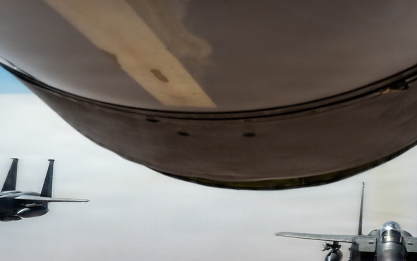KC-135 refuels F-15 for strategic support