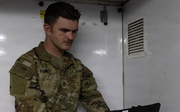 US Soldier uses tactical communications and video-teleconferencing capability