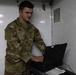 US Soldier uses tactical communications and video-teleconferencing capability