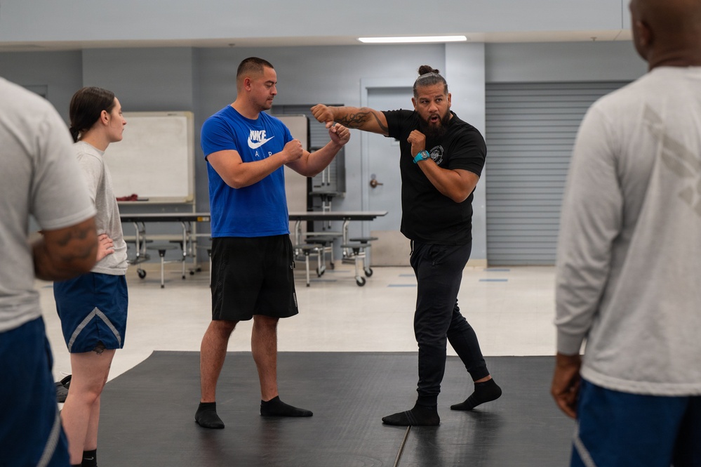 Security Forces sharpen close-quarters combat skills during combatives training