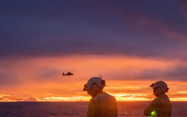 USCGC Midgett (WMSL 757) conducts night flight operations in the South China Sea