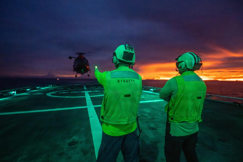 USCGC Midgett (WMSL 757) conducts night flight operations in the South China Sea