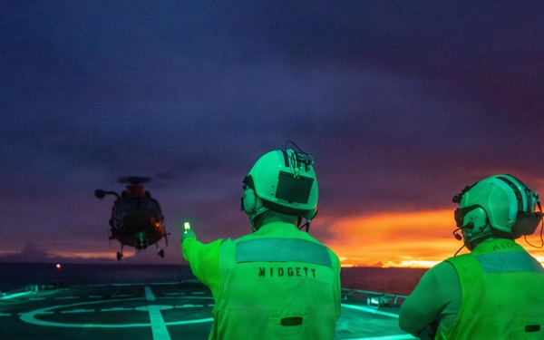 USCGC Midgett (WMSL 757) conducts night flight operations in the South China Sea