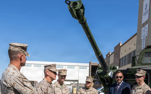 Brigadier General Kevin Collins, commanding general, Marine Corps Logistics Command, meets with civilian-Marines