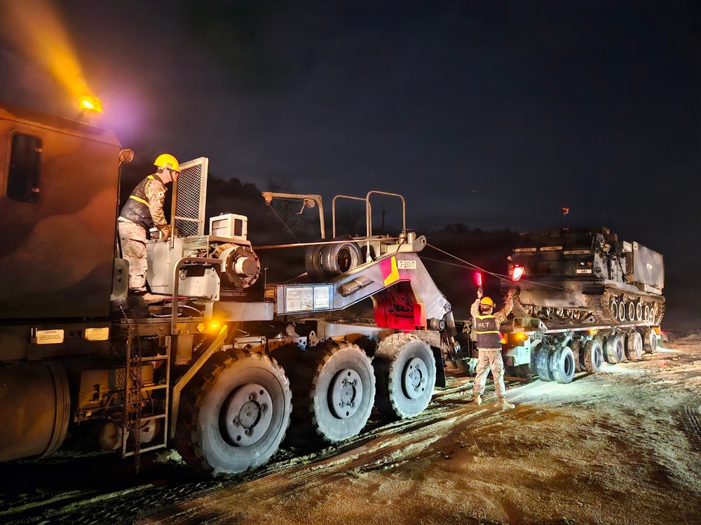 Heavy equipment transporter supports nighttime operations