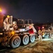 Heavy equipment transporter supports nighttime operations