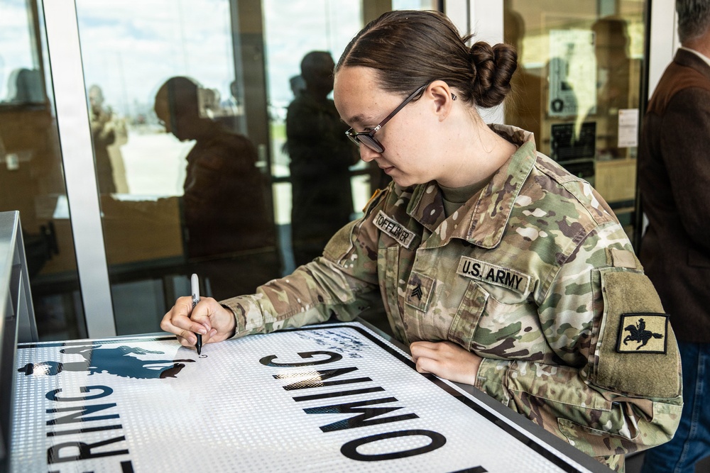 Soldier signs Wyoming deployment tradition