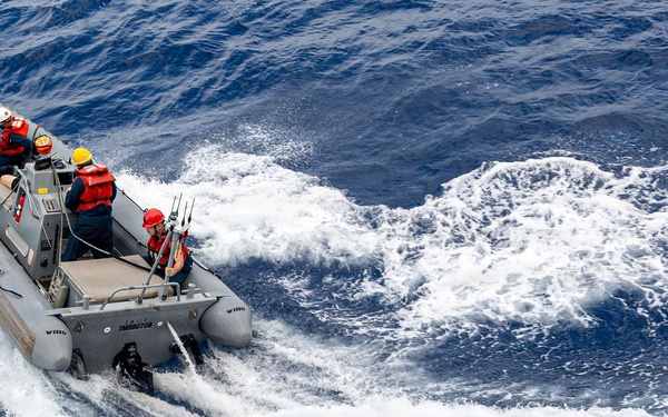 USS Mustin conducts boat operations