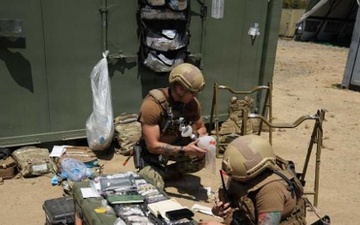Navy Corpsman Integrates Lifesaving Medical Expertise with Tactical Communications in Rugged Training Environment