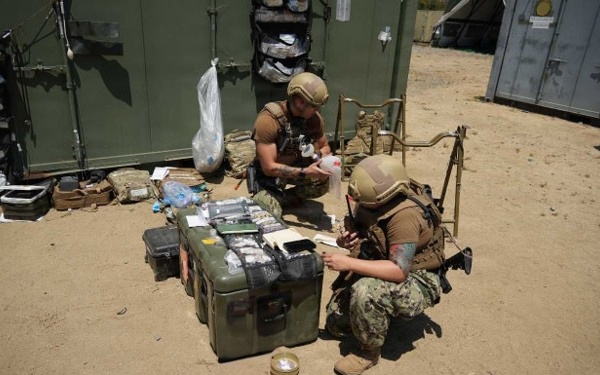 Navy Corpsman Integrates Lifesaving Medical Expertise with Tactical Communications in Rugged Training Environment