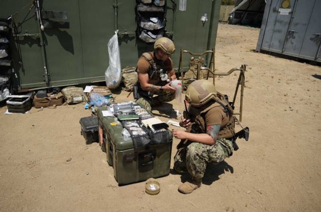 Navy Corpsman Integrates Lifesaving Medical Expertise with Tactical Communications in Rugged Training Environment