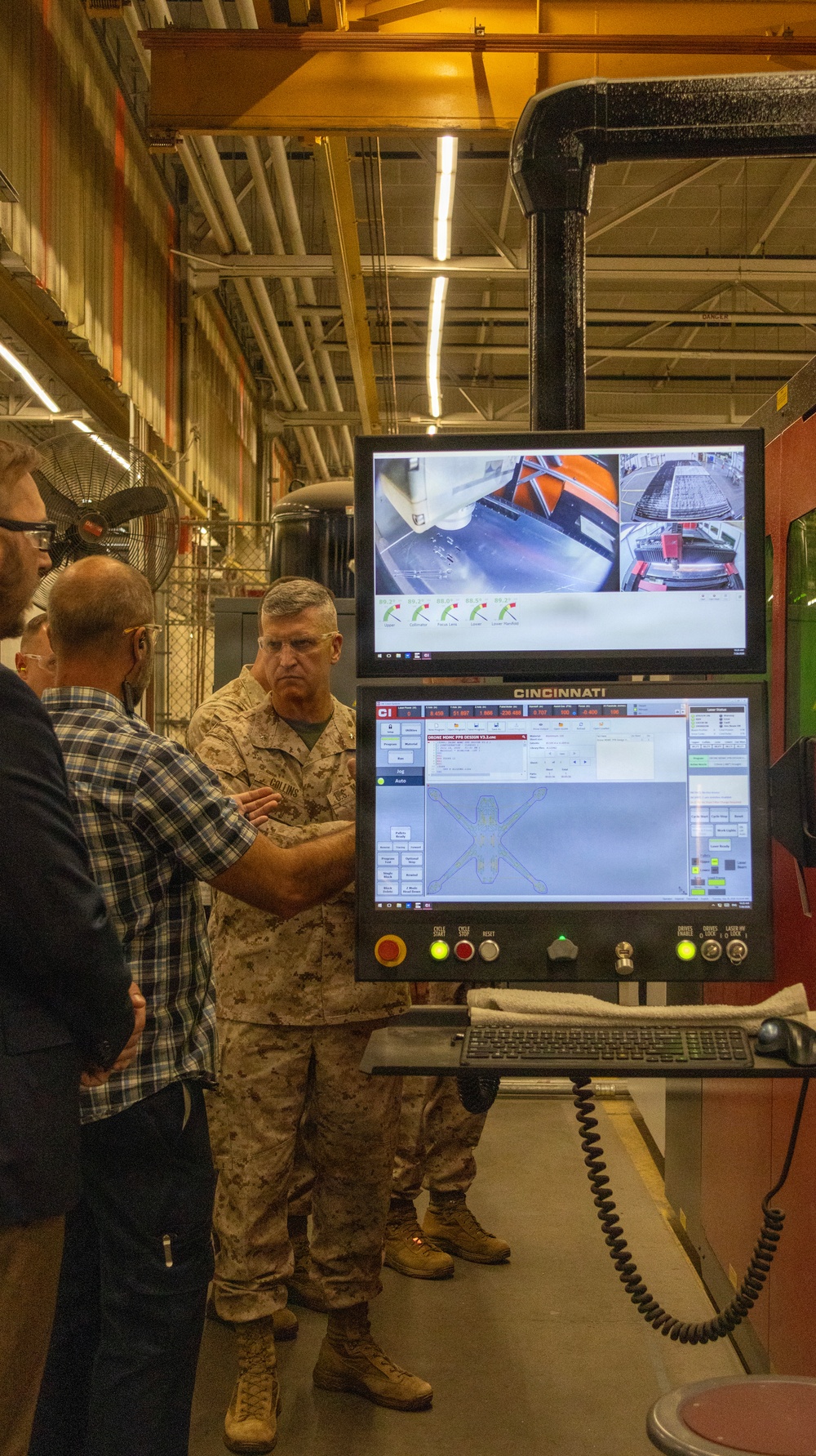 Brigadier General Kevin Collins, commanding general, Marine Corps Logistics Command tours facilities at Production Plant Barstow, California.