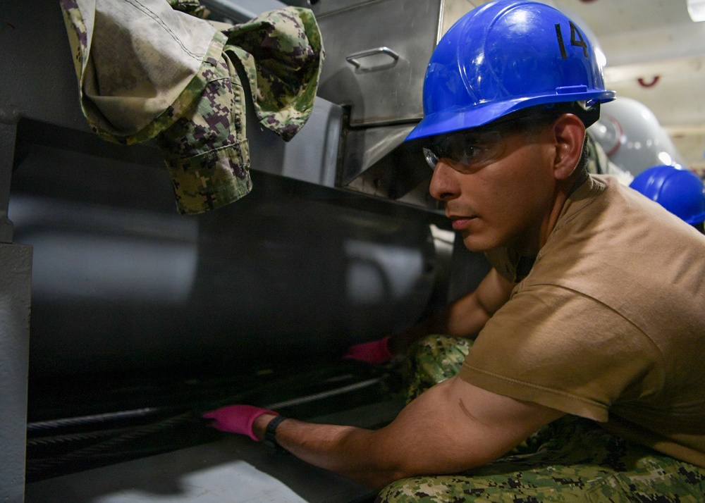 USS John C. Stennis (CVN 74) Sailor conducts maintenence