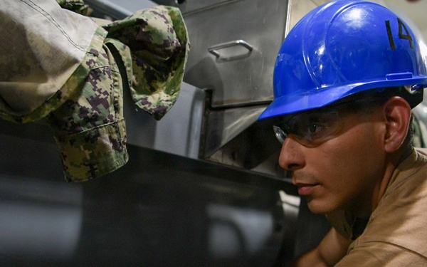 USS John C. Stennis (CVN 74) Sailor conducts maintenence