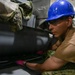 USS John C. Stennis (CVN 74) Sailor conducts maintenence