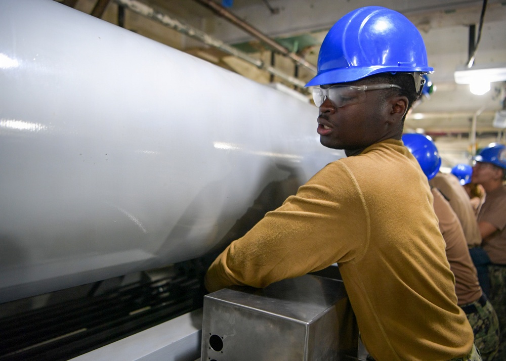 USS John C. Stennis (CVN 74) Sailor conducts maintenence