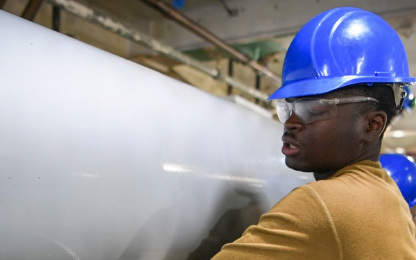 USS John C. Stennis (CVN 74) Sailor conducts maintenence