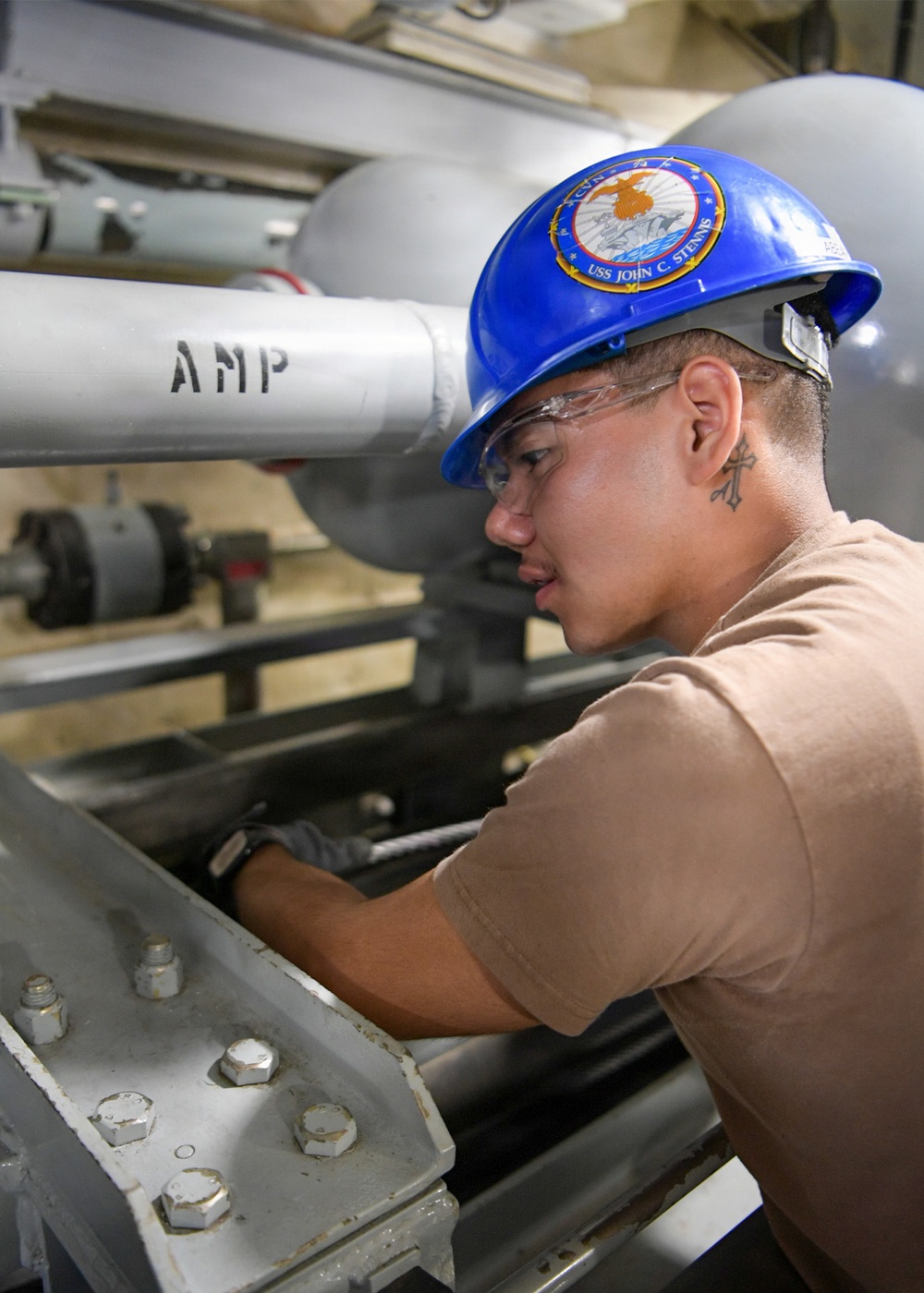 USS John C. Stennis (CVN 74) Sailor conducts maintenence