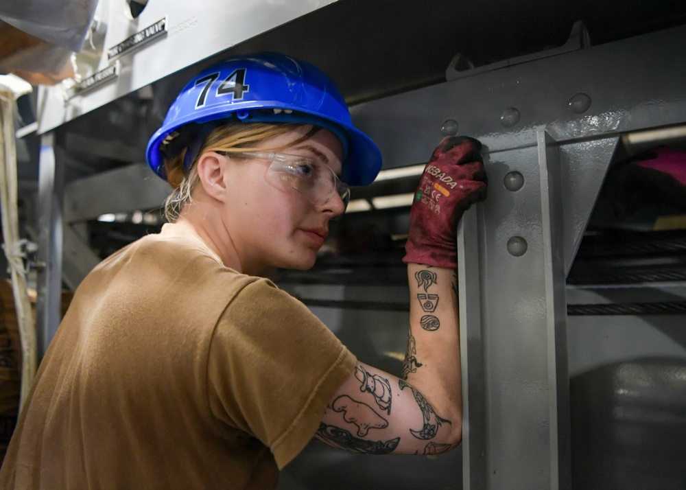 USS John C. Stennis (CVN 74) Sailor conducts maintenence