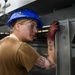 USS John C. Stennis (CVN 74) Sailor conducts maintenence