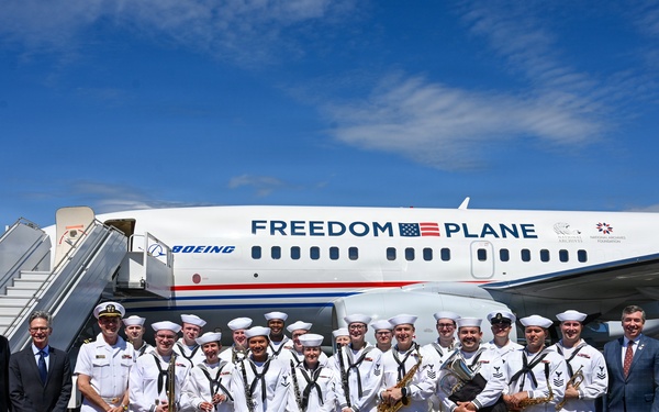 Navy Band Northwest Poses with Freedom Plane