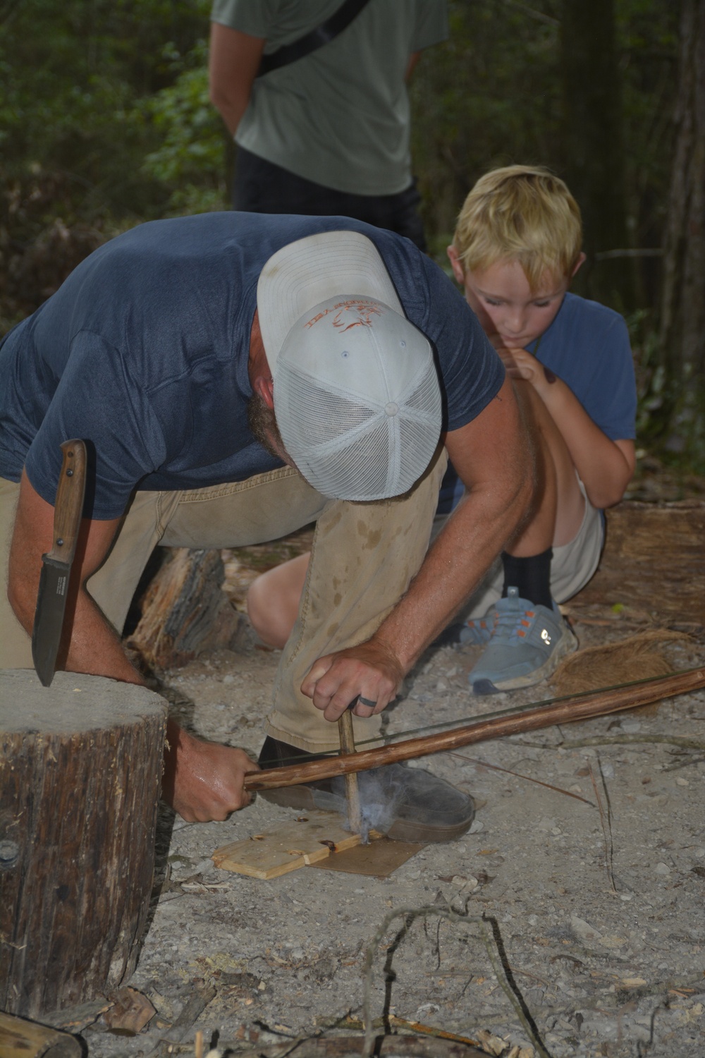 Fire starting with a drill and bow