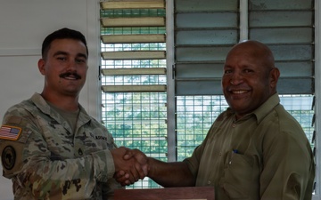 U.S. Army Soldier presents award to Igam Barracks Headmaster during closing ceremony for Exercise Tamiok Strike 26