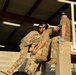 Squadron Officer School students completing obstacle in Leadership Reaction Course
