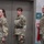 USARIEM COC/Relinquishment of Responsibility 2026 Three U.S. Army soldiers in Operational Camouflage Pattern (OCP) uniforms are standing at attention or in a formal posture inside what appears to be a military or government building. Two females are on the left and center, while a male soldier stands on the right. They appear to be participating in a formal military ceremony or official event.